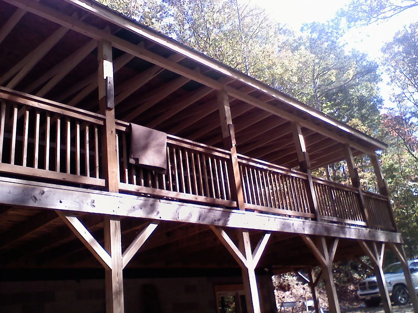 Timber framing under a new elevated porch and deck — Roof Leak Repair in Eagle River by Roofing Brothers